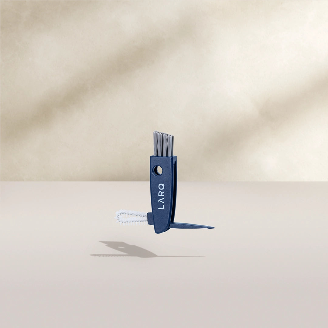 BRITA LARQ Cleaning Brush on a beige background