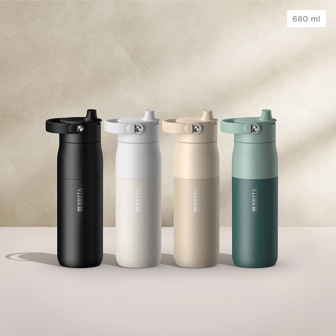 BRITA LARQ Essential Bottles in black, white, beige, and green, 680 ml size, on a beige background.