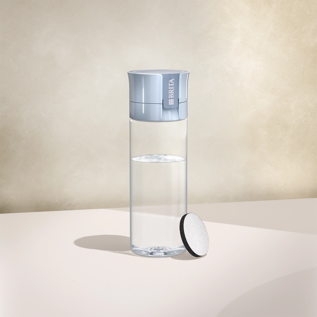 BRITA water filter bottle Vital in light blue on a beige background