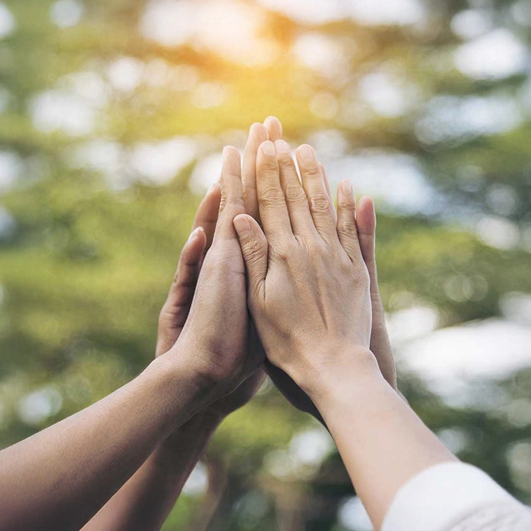 A group of people is clapping their hands.