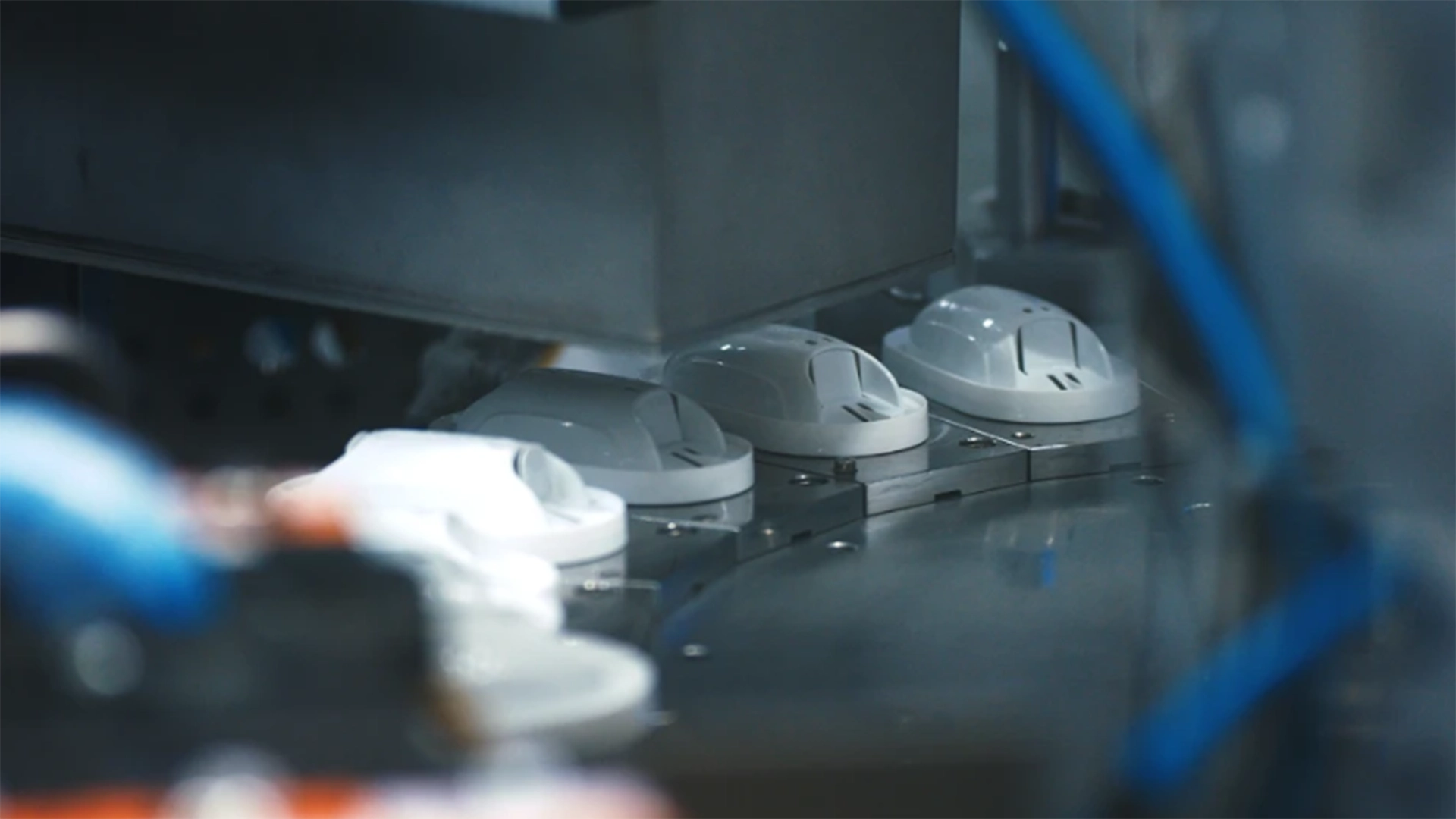 Close-up of MAXTRA PRO water filter cartridge production line.
