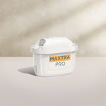 A BRITA MAXTRA PRO LIMESCALE EXPERT water filter cartridge on a beige background