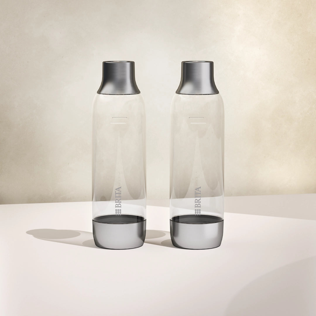 Two BRITA sodaTRIO glass bottles side by side on a white background